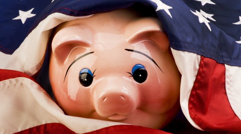 アメリカ国旗と豚の貯金箱のイメージ