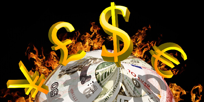 各国の通貨が炎を焚くイメージ